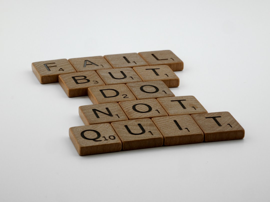 two scrabble tiles spelling fail, but do not quit it