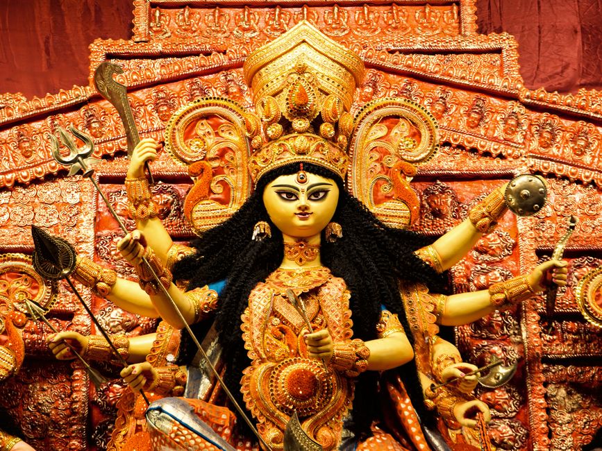 Navaratri goddess idol with colorful decorations and flowers