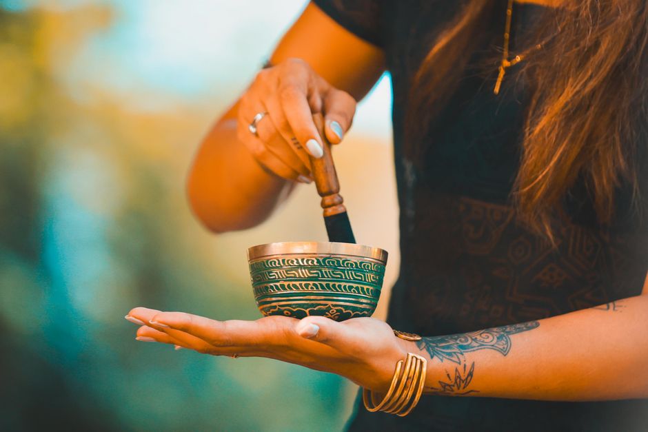 Sanskrit mantra sound healing concept with tuning forks and candles