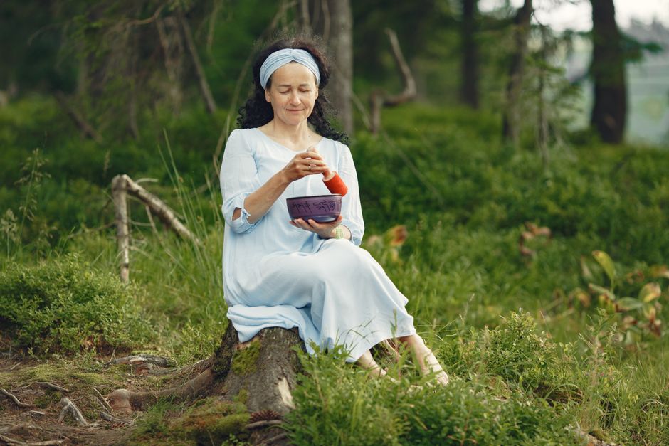 Woman eating nutritious food mindfully outdoors
