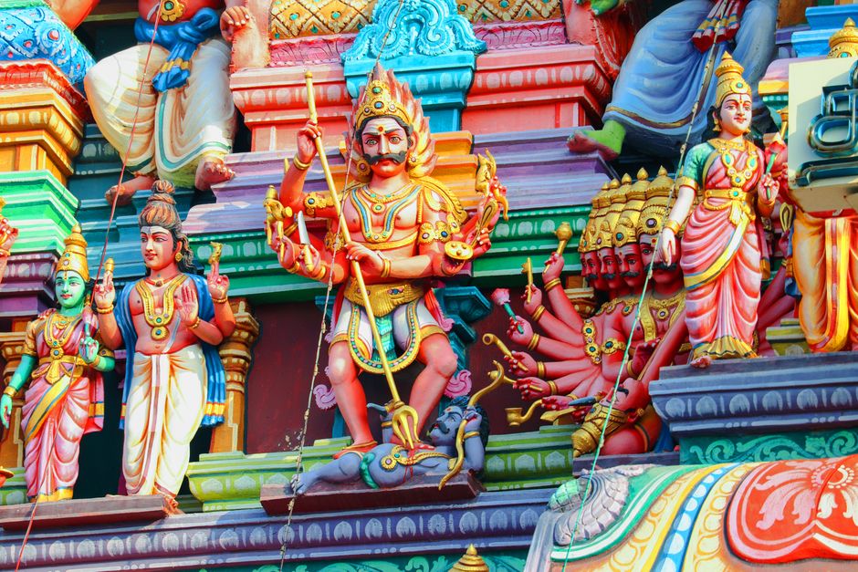 Hindu deity statue with karma and dharma symbols