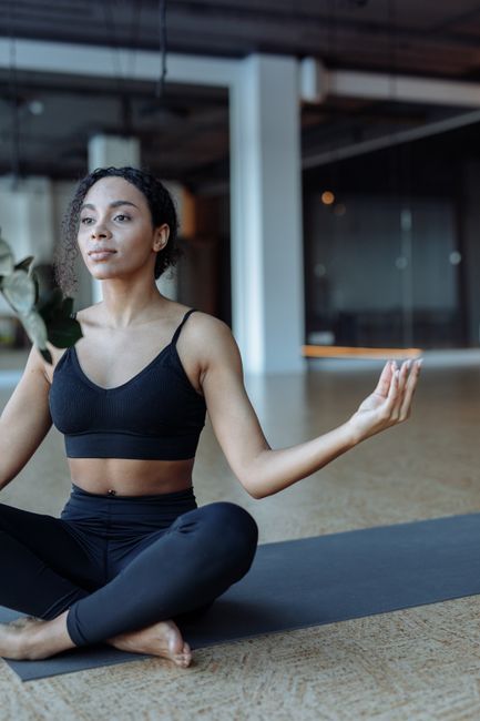 Person meditating in nature with eyes closed