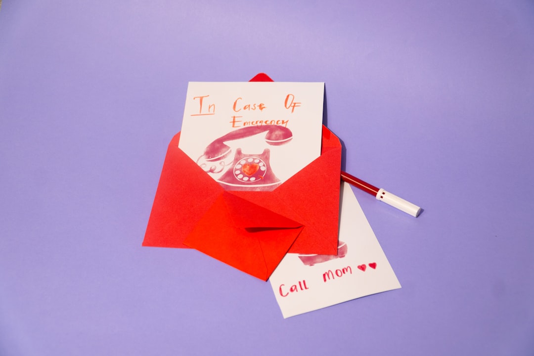 Red envelope with cards featuring a retro telephone design.