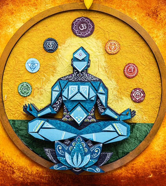 Woman in yoga pose with glowing solar plexus chakra energy